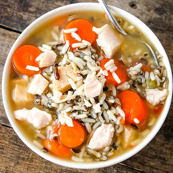 This easy chicken rice soup is perfect when you’re craving something warm and homemade but don’t want to wait around. Using canned chicken keeps it quick, while fresh carrots, celery, and a wild rice blend make it feel hearty and comforting. It’s the kind of soup you can have on the table fast and still feel good about serving.