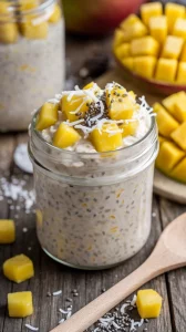 🥭✨ Make-Ahead Tropical Twist Overnight Oats for Busy Days 🥥🥄 These creamy oats with sweet mango and coconut are your perfect breakfast solution! 🌟💛