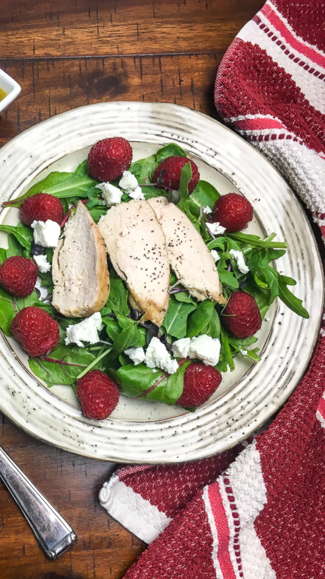 Elegant but Easy Salad Recipe Bright, fresh, and beautifully balanced—this Chicken and Raspberry Salad is an elegant but easy recipe for lunch or light dinner. Paired with a tangy lemon-balsamic vinaigrette and crumbled goat cheese, it's as delicious as it looks. #EasySalads #GoatCheeseSalad #ChickenSaladIdeas #QuickHealthyMeals #RaspberrySalad
