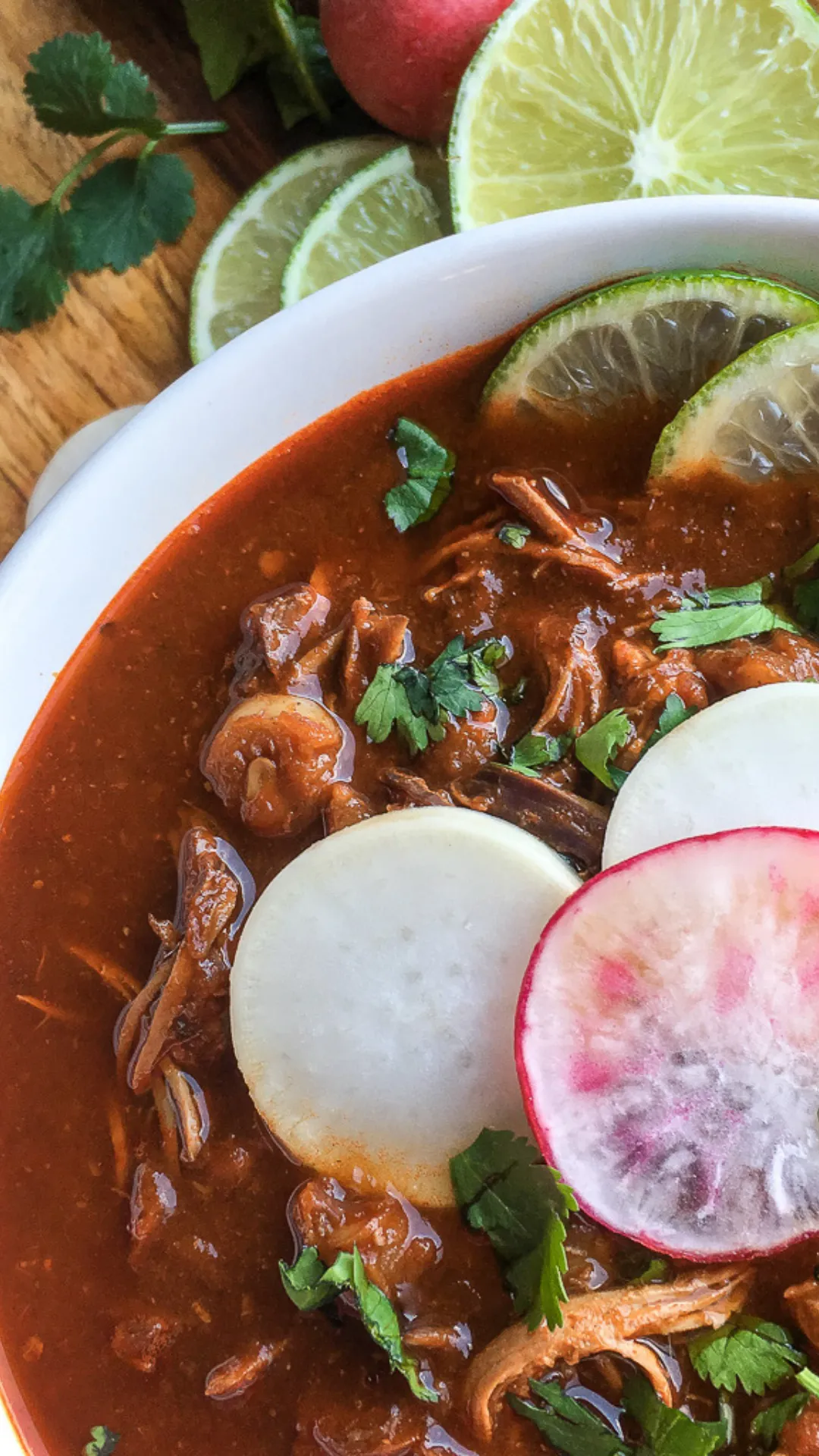 This rich and comforting Pozole Rojo de Pollo swaps pork for tender shredded chicken in a bold red chile broth made with ancho and guajillo chiles. Topped with fresh garnishes like radish, cilantro, and lime, it’s a lighter take on a classic Mexican favorite—perfect for chilly nights or special gatherings. #PozoleRojo #MexicanSoup #ChickenPozole #ComfortFood #OnePotMeals