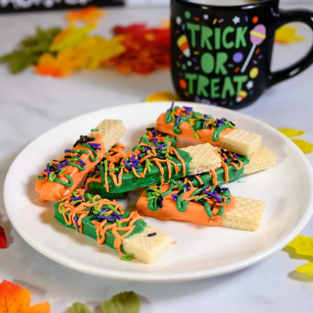 Fun, colorful, and ridiculously easy, these no-bake wafer cookies are dipped in candy melts and topped with spooky sprinkles. They're a great option for busy parents, classroom parties, or letting kids decorate their own with minimal mess.
