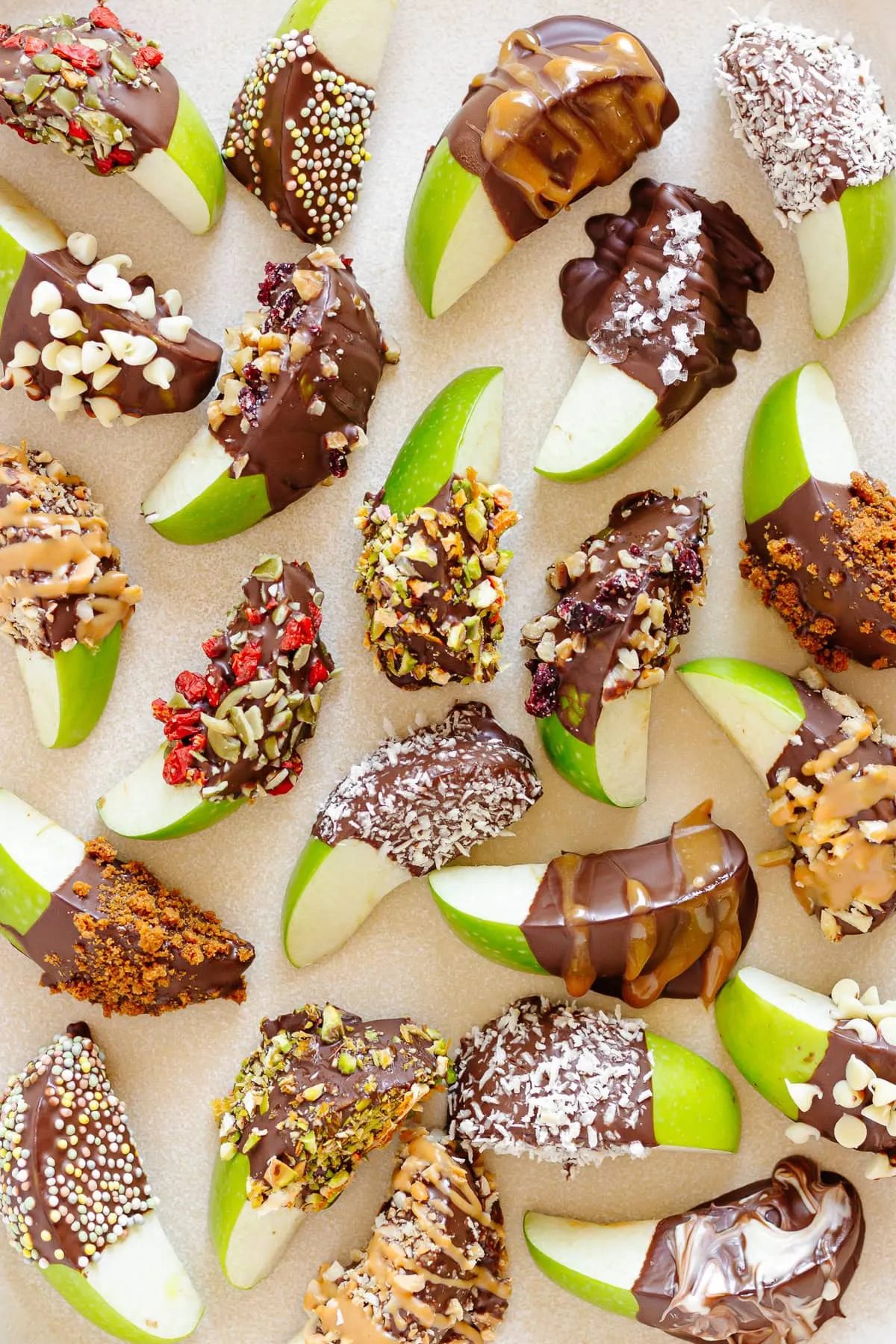 These apple slices get a delicious Halloween makeover with chocolate, caramel, and all sorts of crunchy, spooky toppings. They're fun to customize and make a healthier sweet treat option for your party snack table.