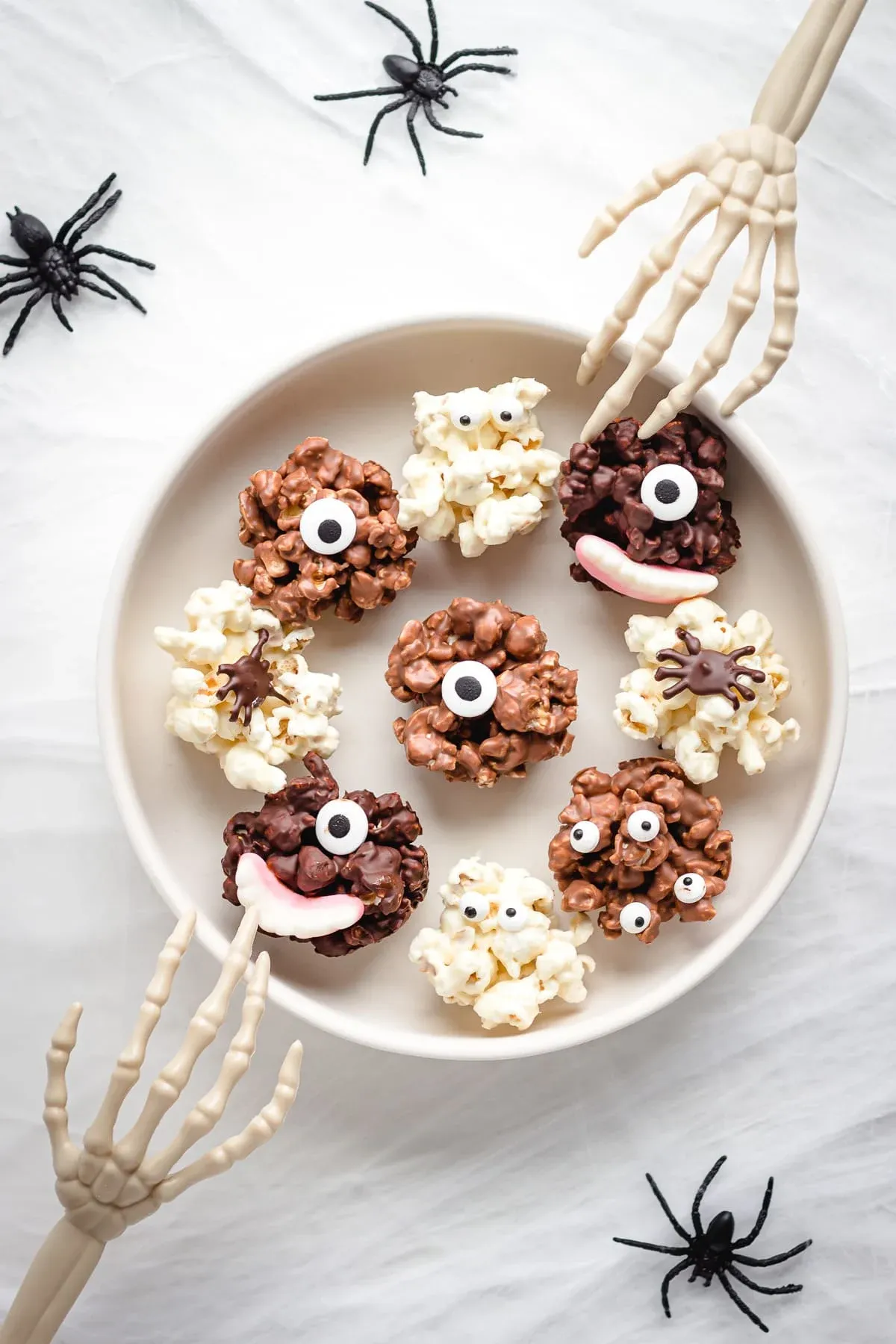Crispy, chocolatey, and full of personality—these popcorn balls are decorated with candy eyes and spooky extras for a treat that's as fun to make as it is to eat. Great for kids’ parties or packaging up for Halloween movie night snacks.