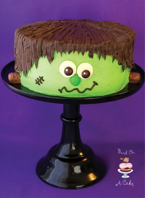 Frankenstein's Monster Cake - Isn't he just the most adorable Frankenstein's Monster you have ever seen? Love the twix as the bolts in the side of his head!