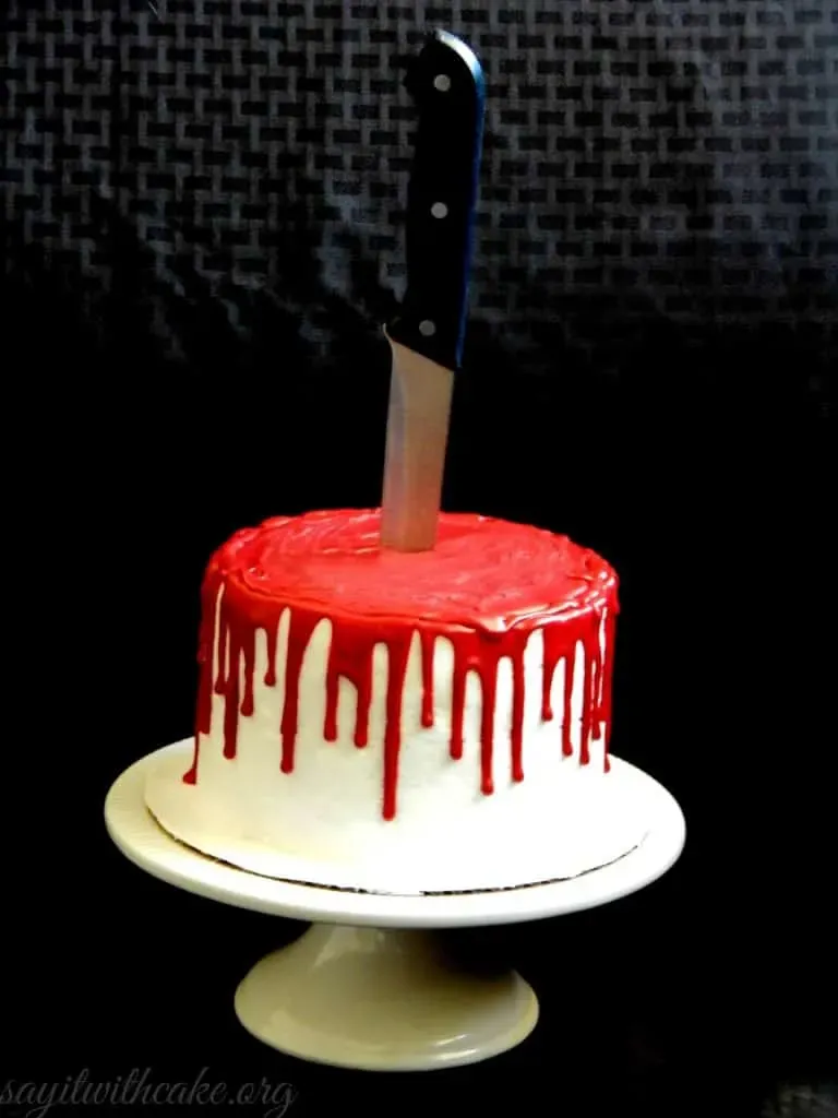 Bloody Halloween Cake - If you're trying to plan a Halloween party and your tween boy is acting like the whole thing is far too babyish for him to bother with... show him this cake!