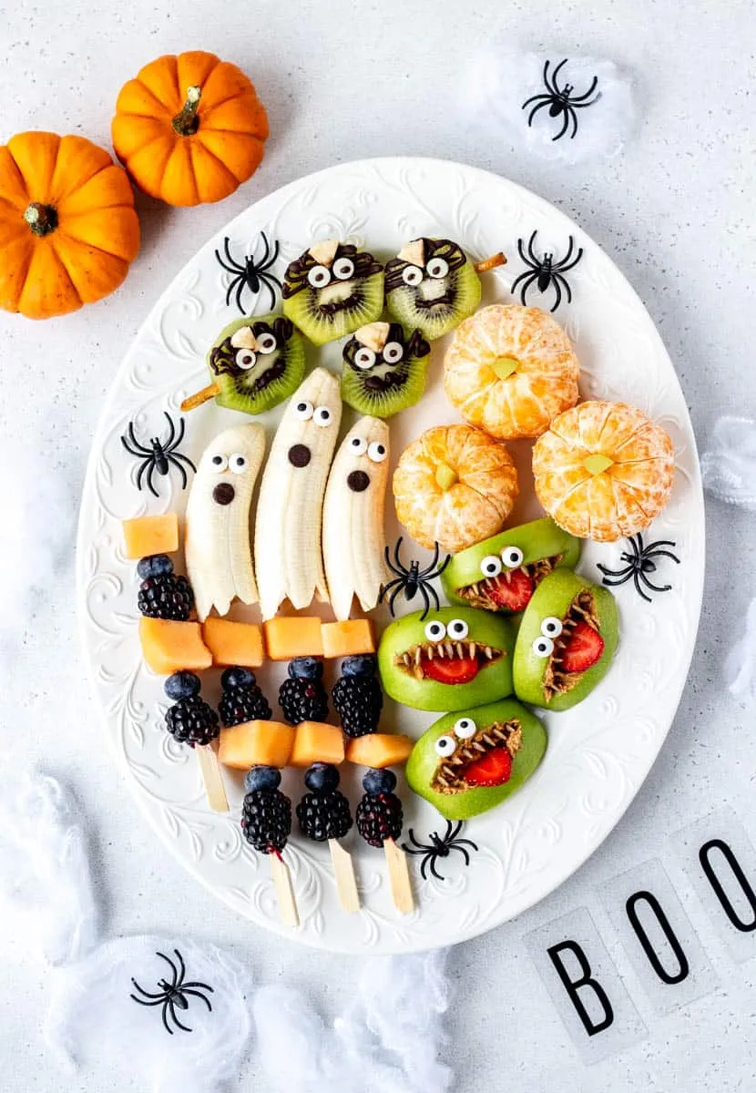 This tray turns ordinary fruit into spooky fun with banana ghosts, monster apples, and spider kiwi. It's a great way to sneak some freshness onto the snack table while still keeping the Halloween theme strong.