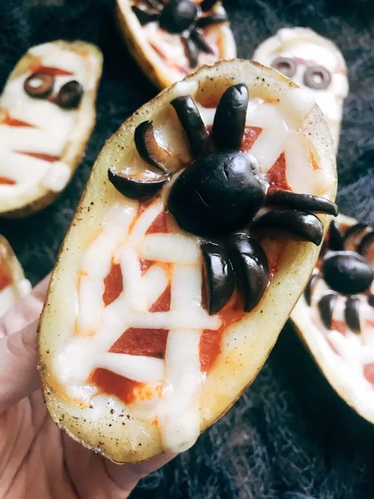Turn ordinary potato skins into creepy mini pizzas with melty mozzarella webs and creepy olive spiders. These are spooky, savory, and a surefire way to impress your Halloween party guests.